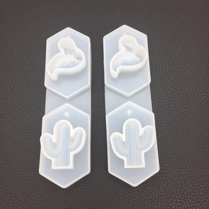 Detailed macro view of hexagonal silicone mold with flamingo and cactus patterns