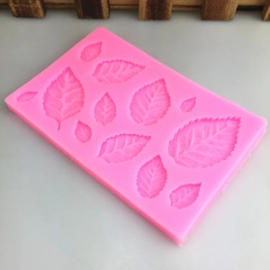 Pink rectangular silicone mold with leaf patterns for DIY fondant and cake decorating