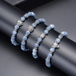 Set of 4 beaded agate bracelets with silver lion, owl, buddha and leopard pendants