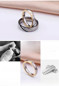 Macro detail of two-tone titanium steel ring with brushed finish and single diamond