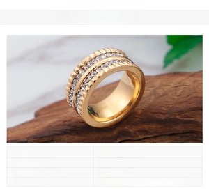 Macro shot of 18K gold plated wide ring with double rows of sparkling cubic zirconia
