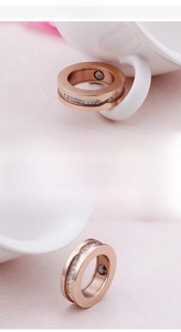 Macro shot of rose gold stainless steel ring with diamond inlay and inner magnet