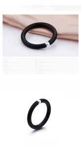 Detail view of 3mm black matte stainless steel ring with single silver pearl bead