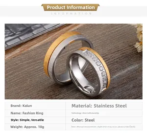Detailed view of two-tone stainless steel brushed rings with embedded zircon stones