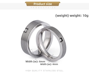Detailed macro view of silver stainless steel rings with grooved patterns and small diamonds