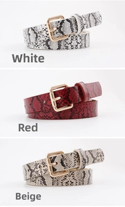 Three colors of slim faux snake skin belts with gold buckles in white red and beige