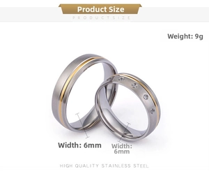 Macro view of 6mm stainless steel couple rings with gold inlay and small diamonds
