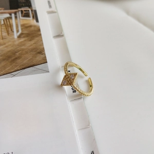 Detail of adjustable S925 sterling silver gold ring with geometric triangles and zircons