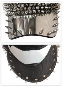 Detail of high-density metal spikes and mirror-effect brim on a black punk baseball cap