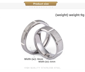 Detail view of 4mm and 6mm brushed stainless steel rings showing matte surface texture