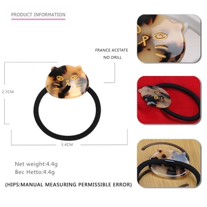 Elastico per capelli gatto in acetato con trama tartarugata e dettagli oro