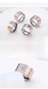 Detailed view of wide tri-color titanium ring featuring a square center stone and zircon inlay