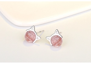 Macro shot of S925 silver cat-shaped stud earrings with pink strawberry quartz stones