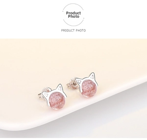 Detailed view of cat-shaped silver earrings with S925 hallmark and pink crystal