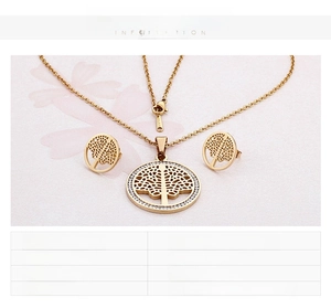 Macro shot of 18K gold and steel Tree of Life jewelry set with zircon accents