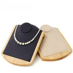 Detail showing high-quality wood necklace display boards with blue and beige velvet inlay