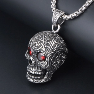 Punk style silver steel skull pendant with red gemstone eyes on a Venetian box chain