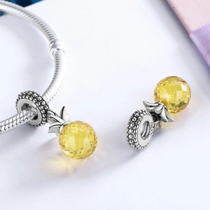 Detail of S925 sterling silver pineapple charm with yellow crystal for DIY bracelet