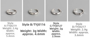 Detail showcasing four S925 silver rings with polished, faceted, and twisted textures