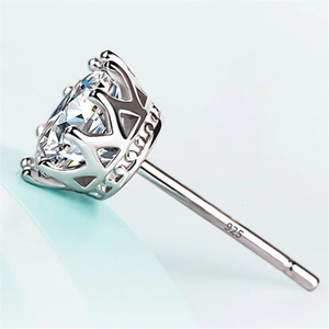 Macro view of 925 sterling silver stud earring with crown setting and round clear stone