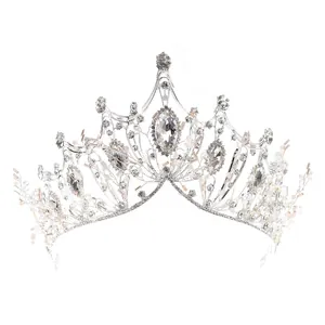 Luxurious silver bridal crown tiara featuring sparkling rhinestones and champagne beads
