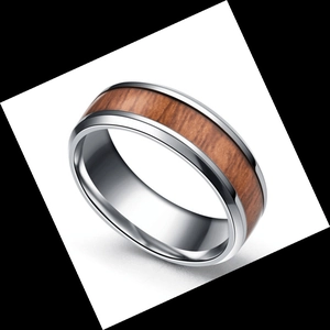 Close-up of men's titanium ring with wood grain inlay and polished silver metal finish