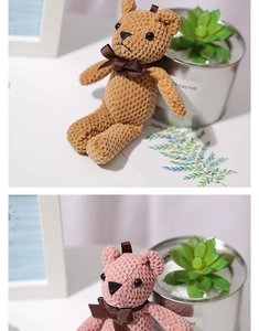 Detail of pink and brown knitted teddy bear plush toys with stylish brown ribbon bows