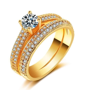 Macro shot of 18K gold plated ring set with a round-cut simulated diamond in 4-prong setting