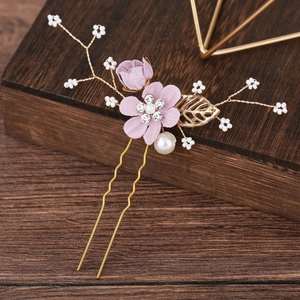 Detailed view of handmade pink fabric flower bridal hair pin with pearls and rhinestones