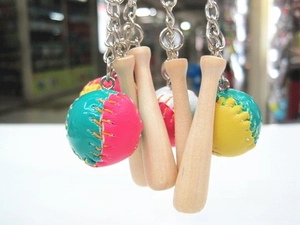 Detail of colorful baseball and mini wooden bat keychain with metallic rings