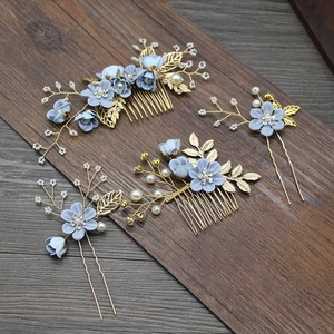 Detailed set of 4 bridal hair accessories with blue fabric flowers and golden leaf pins