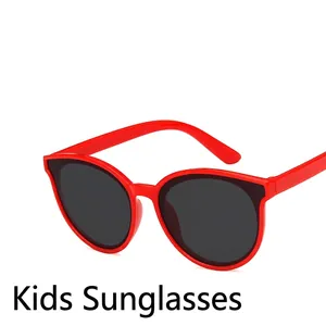 Red round-frame children's sunglasses with UV protection and dark lenses for boys and girls