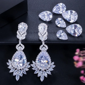 Detailed macro shot of luxury pear-shaped AAA zircon drop earrings with shimmering fringe