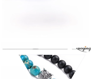 Macro detail of natural emperor stone beads and owl charm with size specifications