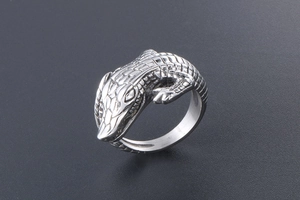 Detailed macro view of retro crocodile ring showing realistic scales and vintage texture