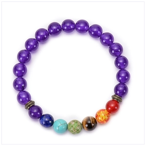 Close-up of natural seven chakra beads with lava stone and vintage metal spacers