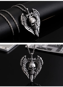 Detail showing vintage gothic skull sword pendant with wings on black leather background