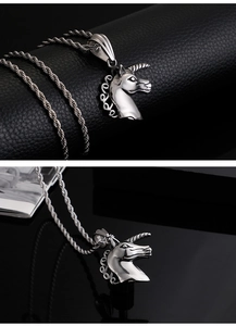 Detailed view of silver unicorn pendant with twisted chain on black texture