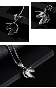 Macro detail of silver unicorn pendant in fine steel with rope chain on black background