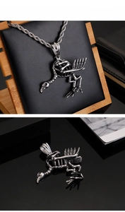 Macro view of vintage silver gothic crow skull pendant with detailed bone texture