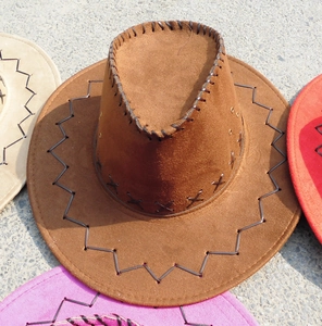 Detail of suede cowboy hat featuring contrast stitching and metal side eyelets