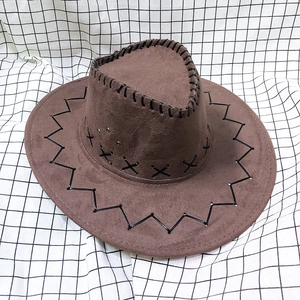 Close-up of a brown Western cowboy hat with black decorative stitching and vent detail