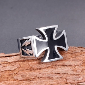 Punk titanium steel cross ring with black enamel inlay on natural wood background