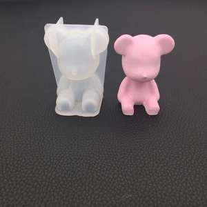 Detailed view of 3D bear silicone mold with a finished pink resin teddy bear ornament