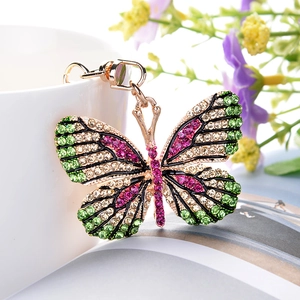 Elegant gold-tone butterfly keychain with colorful green and pink crystals for bags