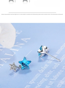 Macro shot of blue crystal star earring with silver setting and zircon detail