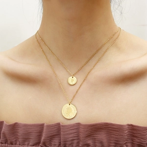 Double-layered gold titanium steel necklace featuring vintage Elizabeth II coin pendants