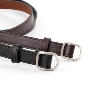 Women's minimalist leather belts in black and brown with silver D-ring buckles