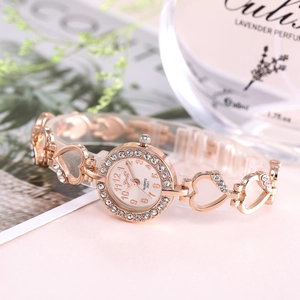 Roségoldene Quarz-Damenuhr mit Strass-Lünette und herzförmigem Metallarmband
