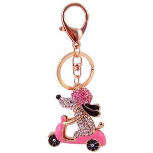 Sparkling rhinestone dog riding pink scooter keychain with gold metal key ring